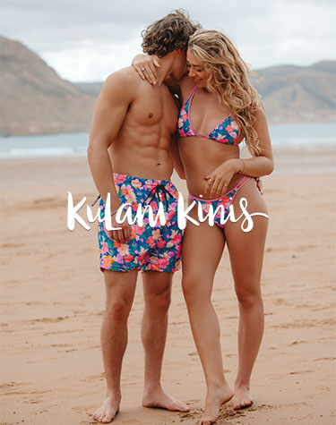 Men and woman wearing matching bikini and volley swimsuit form the brand Kulani Kinis.