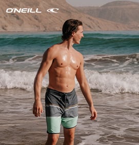 Men wearing an O’Neill boardshort with grey, blue, and yellow stripes on a graphite grey base.