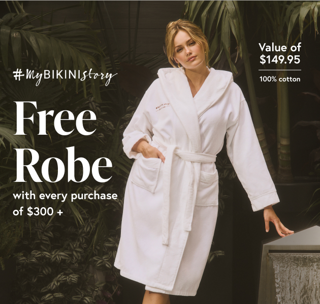 Woman wearing a white robe from the brand #MyBikiniStory made from cotton.
