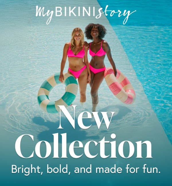 Two women wearing bright pink bikinis in a pool surrounded by colourful balloons, celebrating under the sun. 