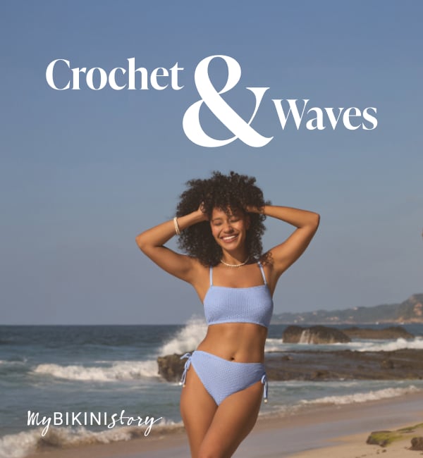 Woman posing on the beach wearing a stylish blue bralette bikini from the My Bikini Story brand, enjoying a sunny seaside moment. 