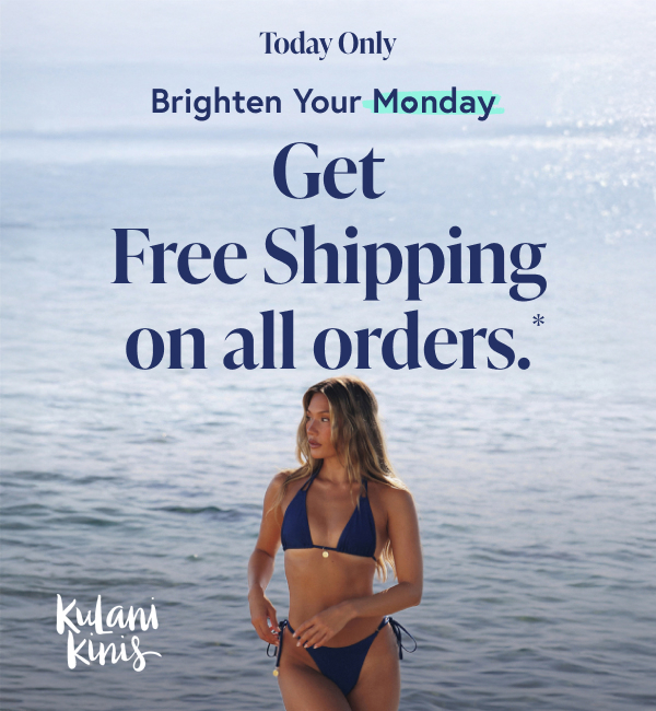 A woman wearing a blue bikini set from Kulani Kinis 