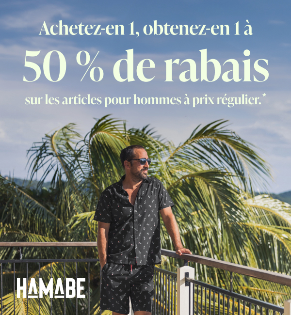 Un homme se tenant sur la rembarde d&rsquo;un balcon et regardant la vue en portant un ensemble assorti d&rsquo;Hamabe. 