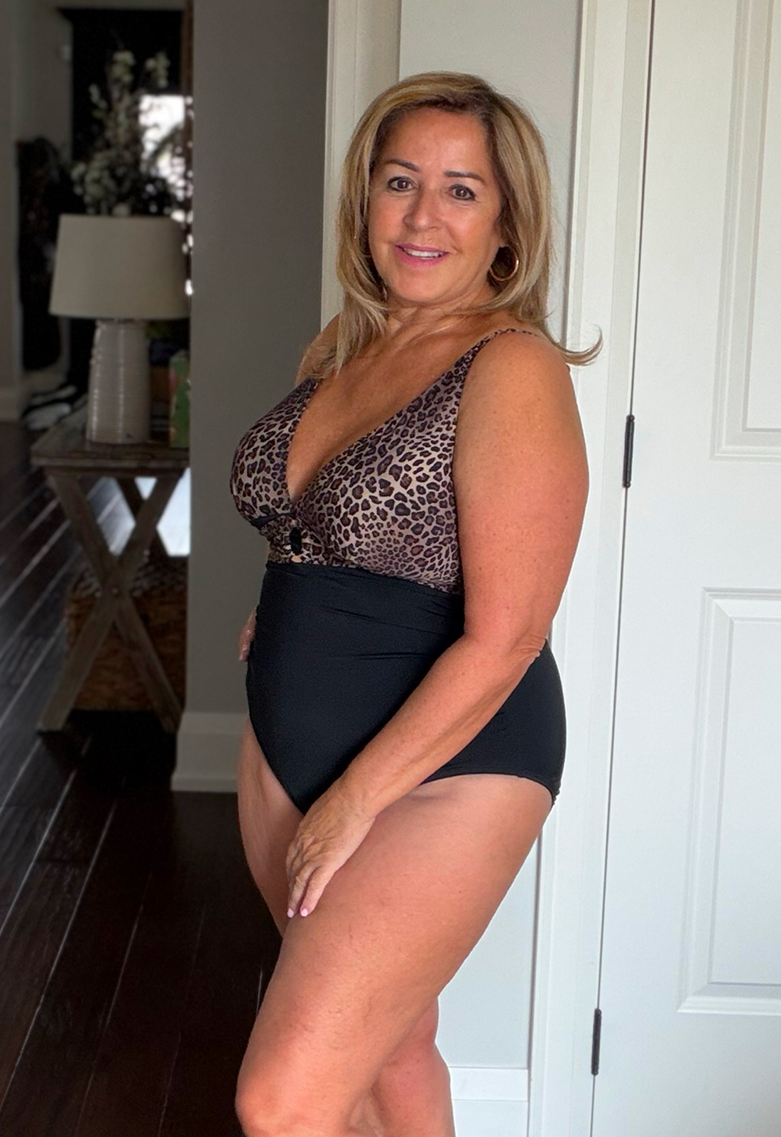 Anita wears the leopard one-piece swimsuit from the Turquoise Couture brand. 