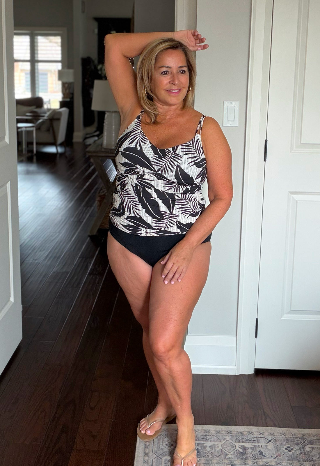 Anita wears the tankini top with a foliage pattern from the Bleu Rod Beattie brand.