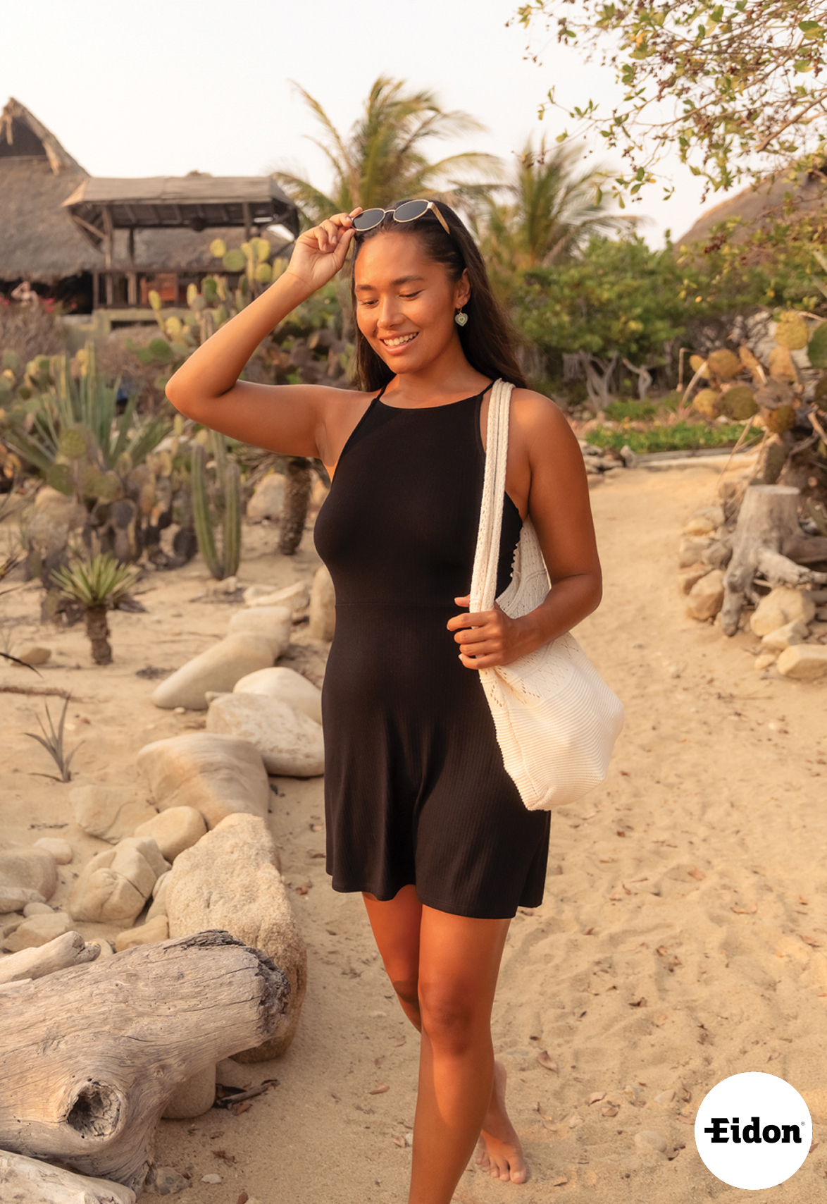 A woman wearing a black dress from Eidon – Bikini Village 