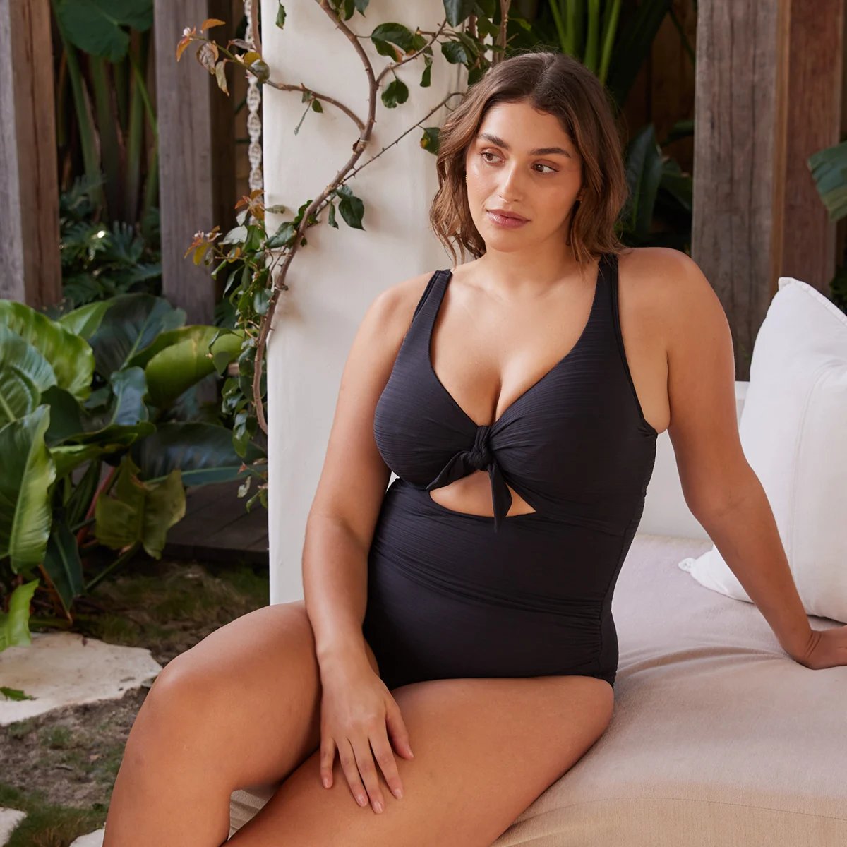 Woman wearing a black Artesands D-DD cup cut-out one-piece swimsuit - Bikini Village