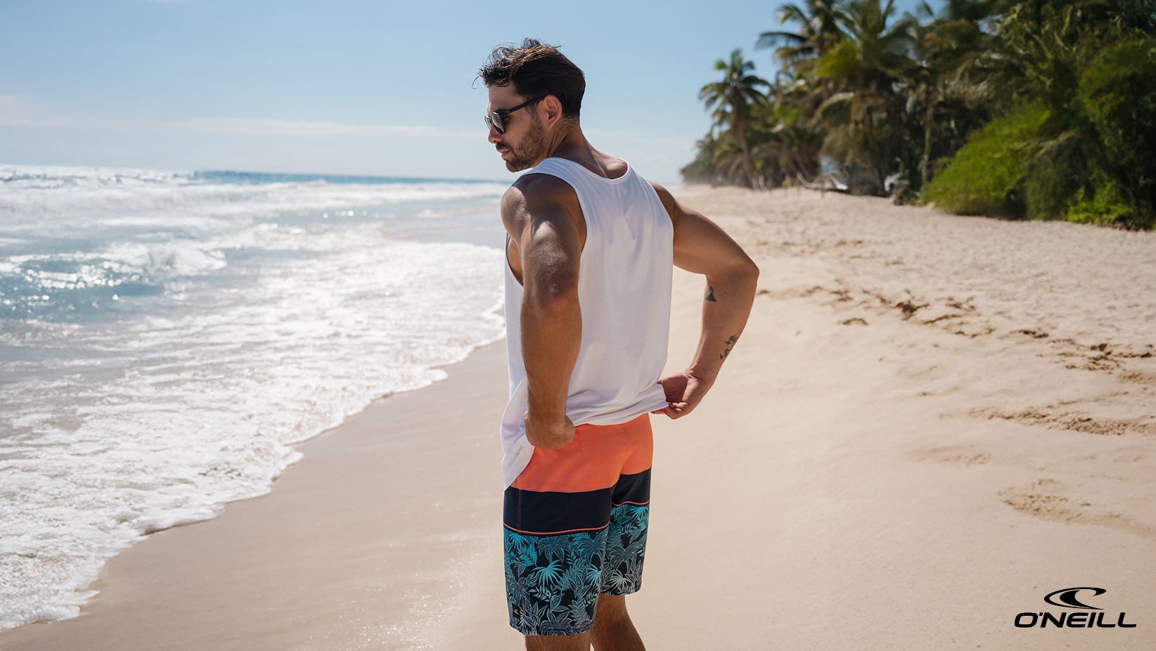 A man wearing a blue and pink O'Neill boardshort – Bikini Village