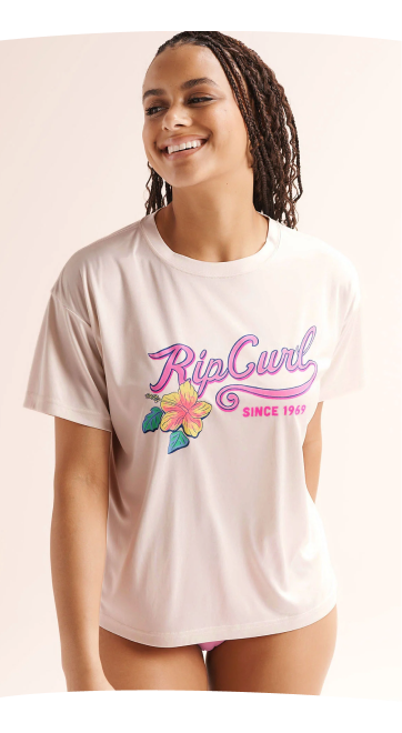 Woman wearing a retro logo T-shirt by Rip Curl.