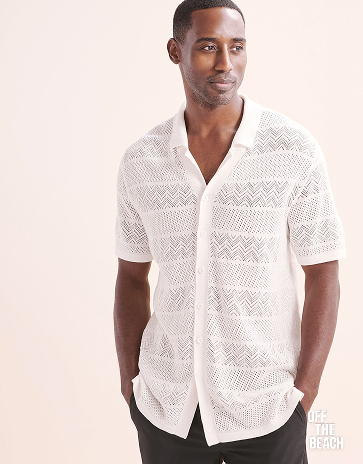 Man wearing a white crochet shirt from Off The Beach.