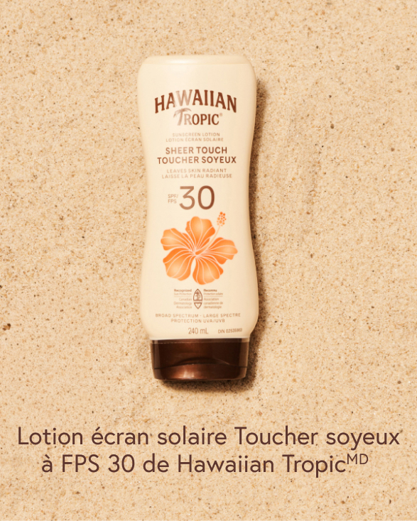 Écran solaire FPS 30 d’Hawaiian Tropic sur le sable