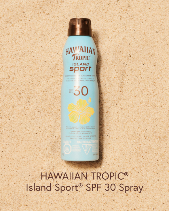 Hawaiian Tropic FPS 30 spray on the sand.