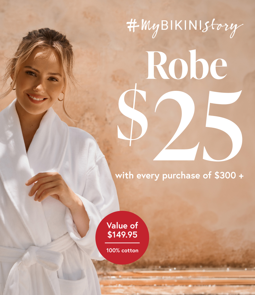 Woman wearing a white coton robe from Bikini Village