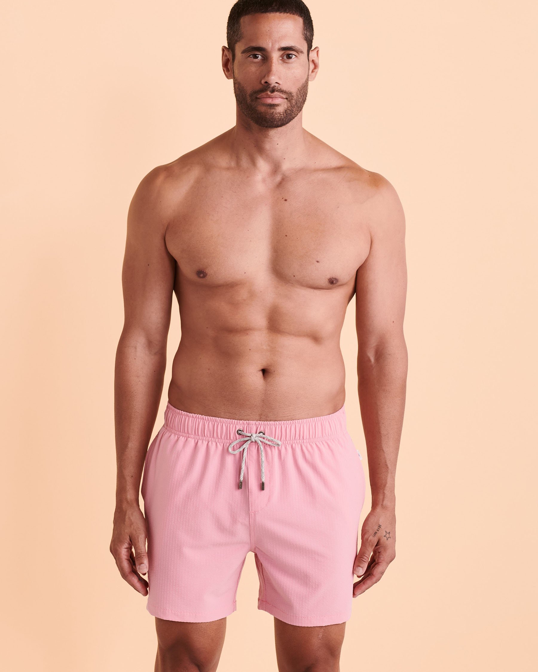 Light pink swim shorts on sale